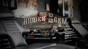 A cover photo of the Hidden Gem Tattoo Studio logo.