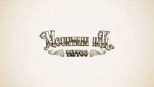 A cover photo of the Mountain Ink Tattoo logo.