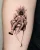 A tiny figure holding what looks to be a person in an armchair, as a balloon - tattoo by Edmonton tattoo artist Jent.