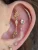 A series of ear piercings by Edmonton piercer Autumn Laschuk