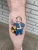 A fallout figure tattoo by Edmonton tattoo artist Katlynn Coulson.