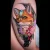 A vividly colourful fox fortune teller tattoo by Edmonton tattoo artist Ashlee Razvik.