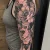 A half sleeve peony tattoo by Edmonton tattoo artist Sasha Day.